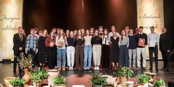 group of students on stage receiving awards