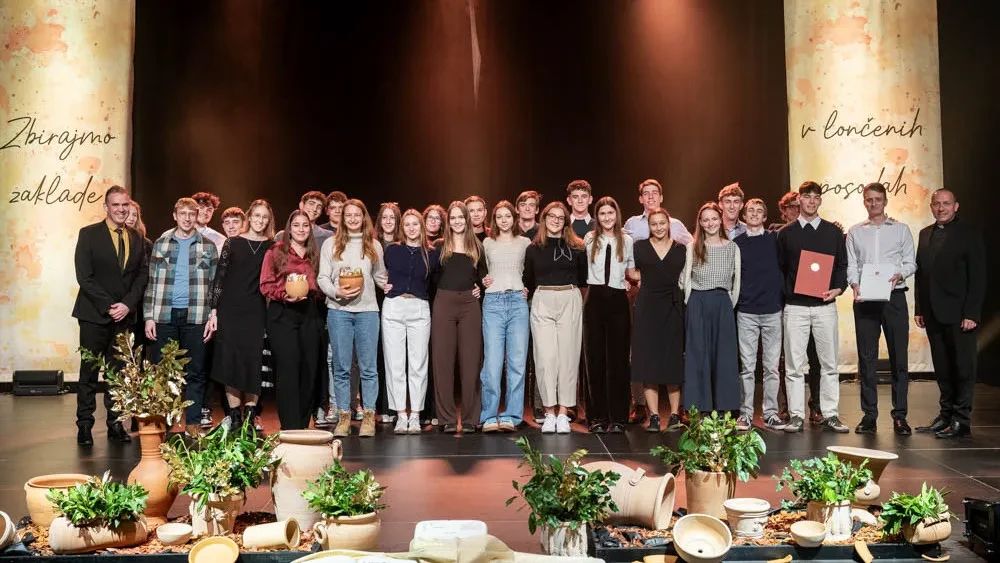 group of students on stage receiving awards