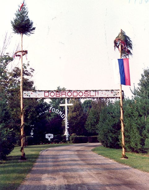 Dobrodosli sign - over roadway with slovenian flag