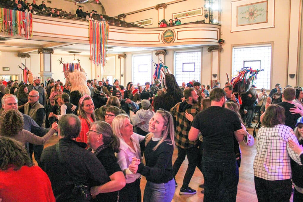 a large group of people dancing polka at the Slovenian National Home