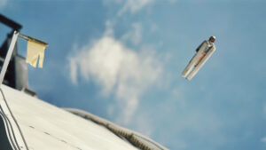 skiier jumping high in the blue sky