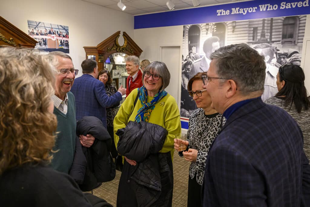 Visitors enjoying the exhibition opening in the Slovenian Museum & Archives.