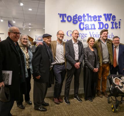 Councilman Mike Polensek, Elizabeth Sullivan, Dr. August Pust, Greg Nosan, Marc Ashed, Slovenian Consul General Susana Češarek, Brad and Trudy Nosan, and Joe Cimperman take a moment to celebrate.