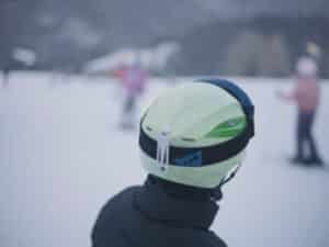 back of head of snowboarder in snow