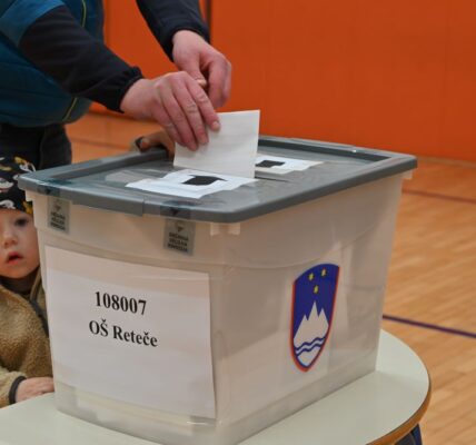 citizen voting with child watching