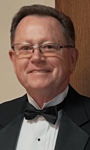 portrait of Edi Mejac in tuxedo and bowtie